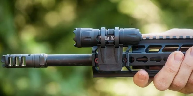 ZRX flashlight mounted on side of rifle with picatinny rail