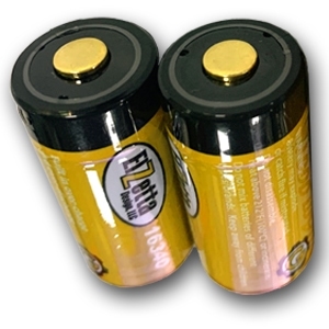 Two Elzetta rechargeable RCR123 batteries with USB port standing on end.