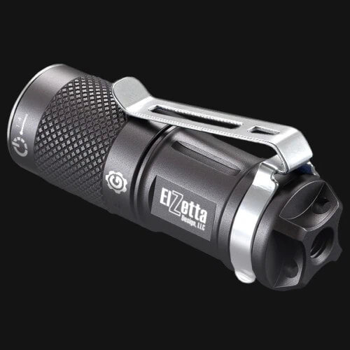 Elzetta G-EDC-RCR Flashlight Showing Tail Stand Threads on Tail End of Light and Elzetta Logo on Side of Flashlight. Black Background