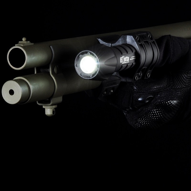 Close up of Elzetta ZSM Shotgun Flashlight Mount in action mounted on shotgun barrel